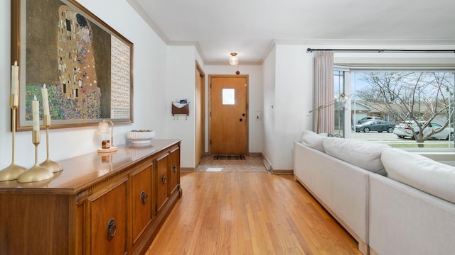5660 N Rogers Ave, Chicago, IL 60646 - entrance foyer featuring light wood-style flooring and ornamental molding