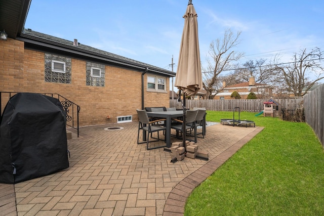 5660 N Rogers Ave, Chicago, IL 60646 - fenced backyard featuring a grill, a patio, and outdoor dining area