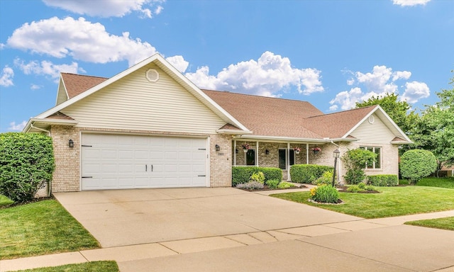 2809 Slayback St, Urbana, IL 61802 - traditional-style house featuring brick siding, a garage, concrete driveway, a front lawn, and a shingled roof