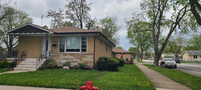 14300 S Palmer Ave, Posen, IL 60469 - view of front of property featuring a front lawn, brick siding, and stone siding