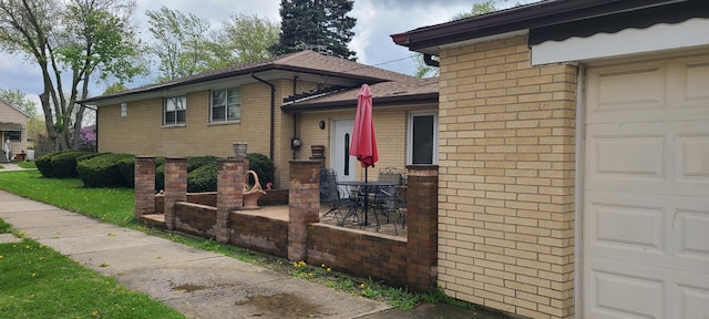14300 S Palmer Ave, Posen, IL 60469 - view of property exterior featuring brick siding and an attached garage