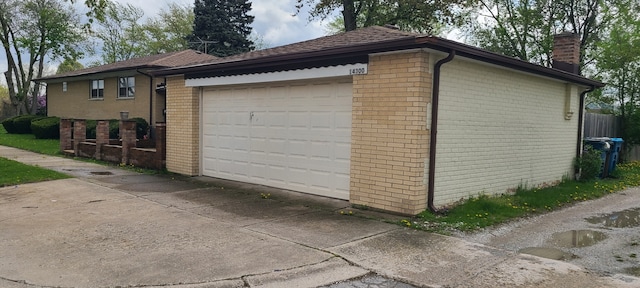 14300 S Palmer Ave, Posen, IL 60469 - view of side of property featuring brick siding, a garage, and a chimney
