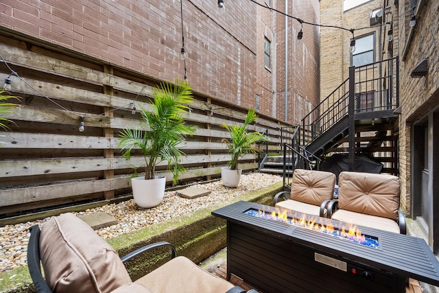 2150 W N Ave Unit 4, Chicago, IL 60647 - view of patio featuring an outdoor fire pit and stairway