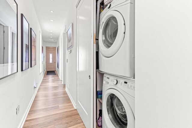 1420 W Fulton St, Chicago, IL 60607 - laundry room with stacked washer / drying machine, light wood-style flooring, and recessed lighting