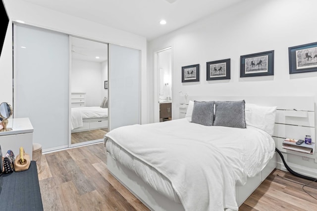 1420 W Fulton St, Chicago, IL 60607 - bedroom with wood finished floors, a closet, and recessed lighting