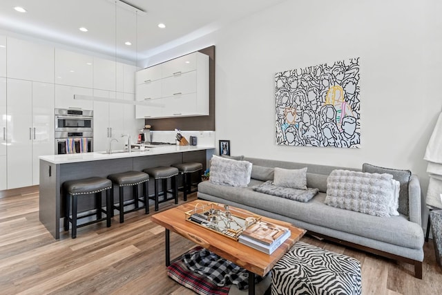 1420 W Fulton St, Chicago, IL 60607 - living area featuring light wood-style floors and recessed lighting
