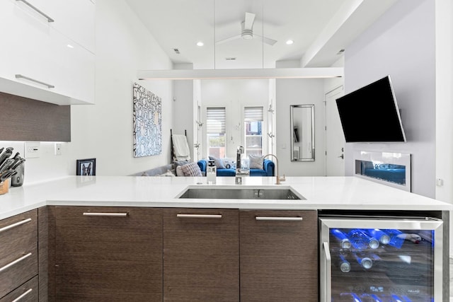 1420 W Fulton St, Chicago, IL 60607 - kitchen featuring modern cabinets, open floor plan, beverage cooler, dark brown cabinets, and ceiling fan