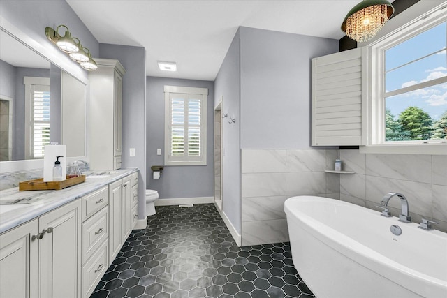 619 County Road 2550 N, Dewey, IL 61840 - bathroom featuring a soaking tub, vanity, and plenty of natural light