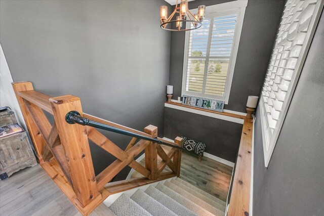 619 County Road 2550 N, Dewey, IL 61840 - stairs with wood finished floors and a chandelier