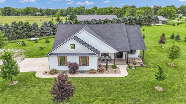 619 County Road 2550 N, Dewey, IL 61840 - view of front of house with a front lawn, view of wooded area, and a porch