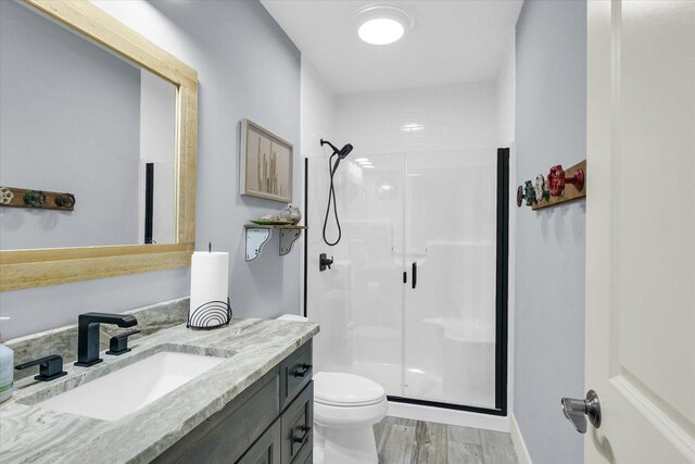 619 County Road 2550 N, Dewey, IL 61840 - bathroom featuring a shower stall, vanity, and wood finished floors