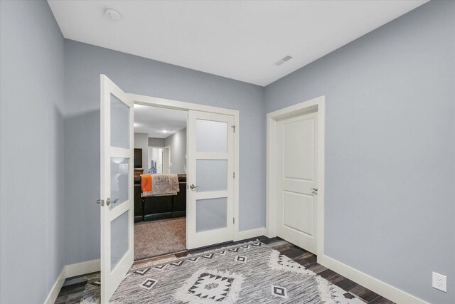 619 County Road 2550 N, Dewey, IL 61840 - unfurnished bedroom with french doors and dark wood-style floors