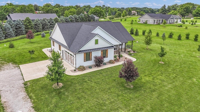 619 County Road 2550 N, Dewey, IL 61840 - view of front facade with driveway, a front yard, and a metal roof