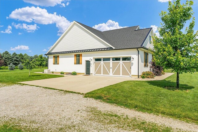 619 County Road 2550 N, Dewey, IL 61840 - view of front facade with concrete driveway, a front lawn, a garage, and roof with shingles