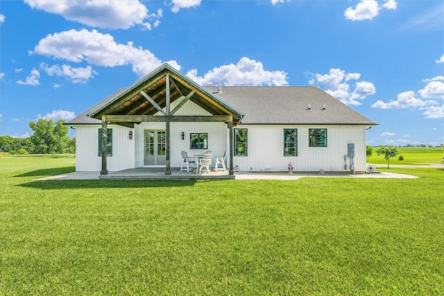 619 County Road 2550 N, Dewey, IL 61840 - rear view of property with a patio area, a yard, a shingled roof, and french doors