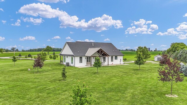 619 County Road 2550 N, Dewey, IL 61840 - rear view of property featuring a lawn and a patio area