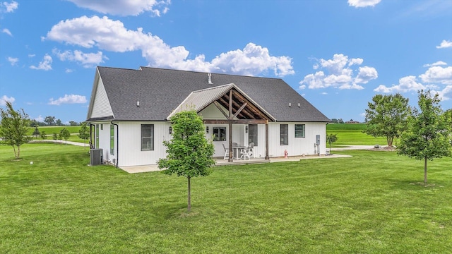 619 County Road 2550 N, Dewey, IL 61840 - back of house with a yard, a patio, and a shingled roof