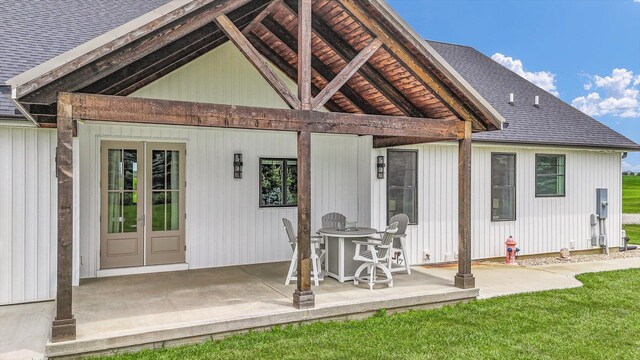 619 County Road 2550 N, Dewey, IL 61840 - back of property with roof with shingles, a patio, a yard, and french doors