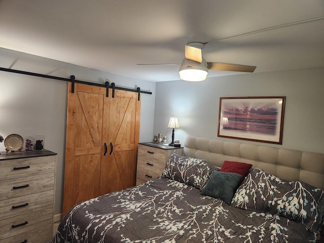 2149 Country Club Dr Unit 16, Woodridge, IL 60517 - bedroom featuring a barn door and ceiling fan