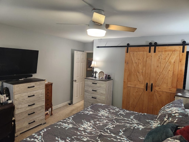 2149 Country Club Dr Unit 16, Woodridge, IL 60517 - carpeted bedroom featuring a barn door and a ceiling fan