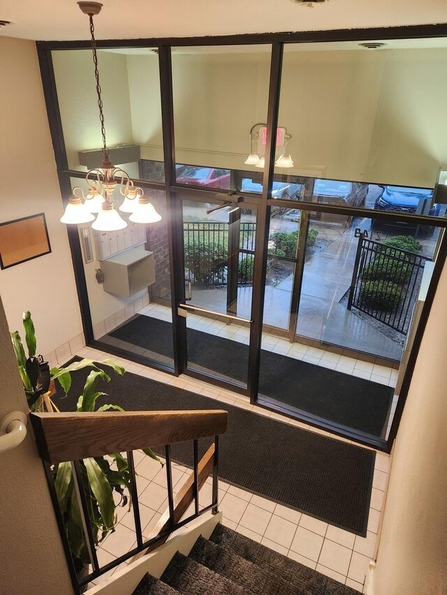 2149 Country Club Dr Unit 16, Woodridge, IL 60517 - sunroom / solarium featuring a chandelier