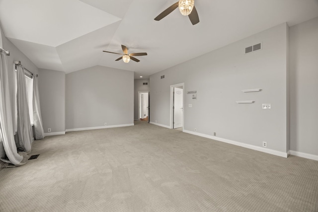 W3318 Lake Forest Ln, Lake Geneva, WI 53147 - spare room with ceiling fan, light colored carpet, and vaulted ceiling