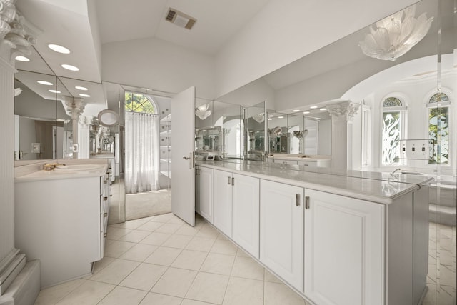 W3318 Lake Forest Ln, Lake Geneva, WI 53147 - full bathroom featuring vaulted ceiling, two vanities, tile patterned flooring, an enclosed shower, and recessed lighting
