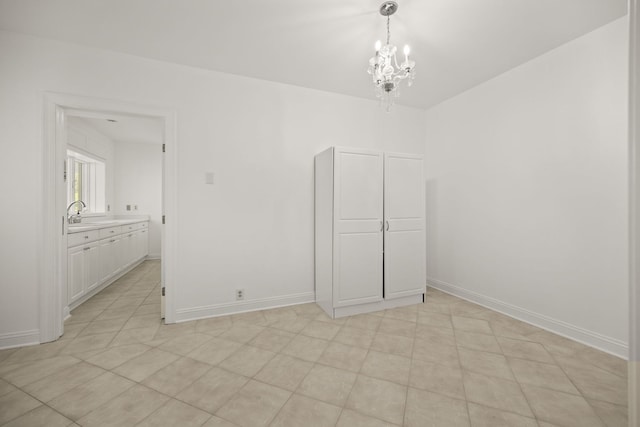 W3318 Lake Forest Ln, Lake Geneva, WI 53147 - spare room featuring a chandelier and baseboards