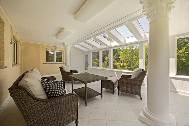 W3318 Lake Forest Ln, Lake Geneva, WI 53147 - sunroom with ornate columns, a skylight, tile patterned flooring, and lofted ceiling