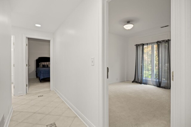 W3318 Lake Forest Ln, Lake Geneva, WI 53147 - corridor featuring light carpet, recessed lighting, and light tile patterned floors