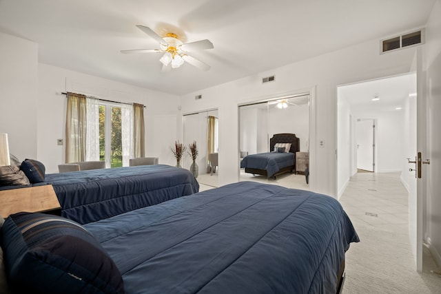 W3318 Lake Forest Ln, Lake Geneva, WI 53147 - bedroom featuring light carpet, two closets, and a ceiling fan