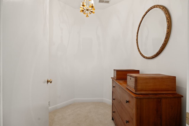 W3318 Lake Forest Ln, Lake Geneva, WI 53147 - hall featuring a chandelier and light colored carpet