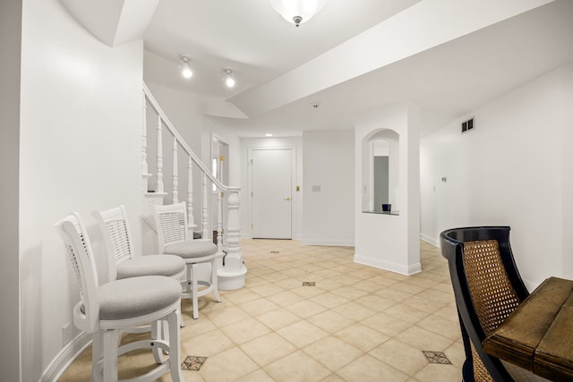 W3318 Lake Forest Ln, Lake Geneva, WI 53147 - foyer featuring light tile patterned flooring and stairs