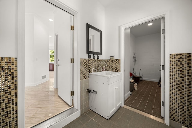 W3318 Lake Forest Ln, Lake Geneva, WI 53147 - bathroom featuring tile walls, vanity, tile patterned floors, a wainscoted wall, and recessed lighting