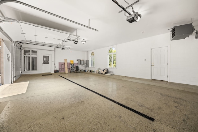 W3318 Lake Forest Ln, Lake Geneva, WI 53147 - garage featuring a garage door opener and a heating unit