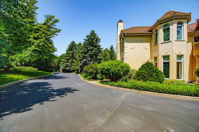 W3318 Lake Forest Ln, Lake Geneva, WI 53147 - view of asphalt road with curbs