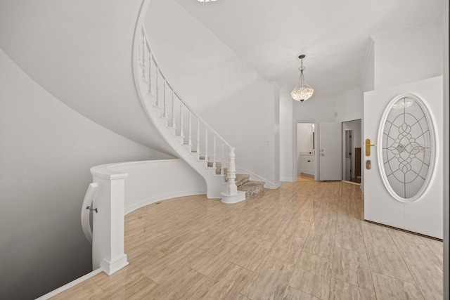 W3318 Lake Forest Ln, Lake Geneva, WI 53147 - entrance foyer featuring a towering ceiling, stairway, and a chandelier