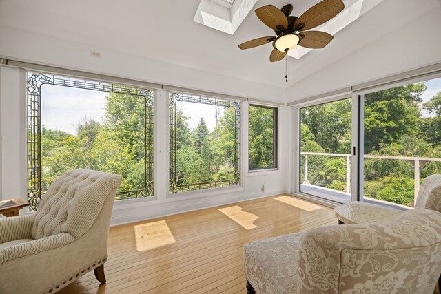 W3318 Lake Forest Ln, Lake Geneva, WI 53147 - sunroom featuring ceiling fan, a skylight, and vaulted ceiling