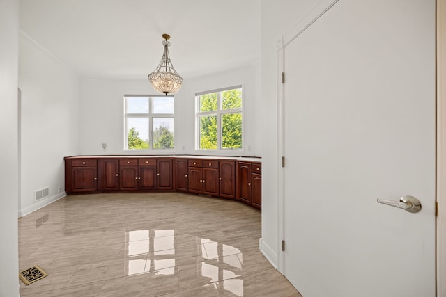 W3318 Lake Forest Ln, Lake Geneva, WI 53147 - empty room featuring a chandelier and baseboards