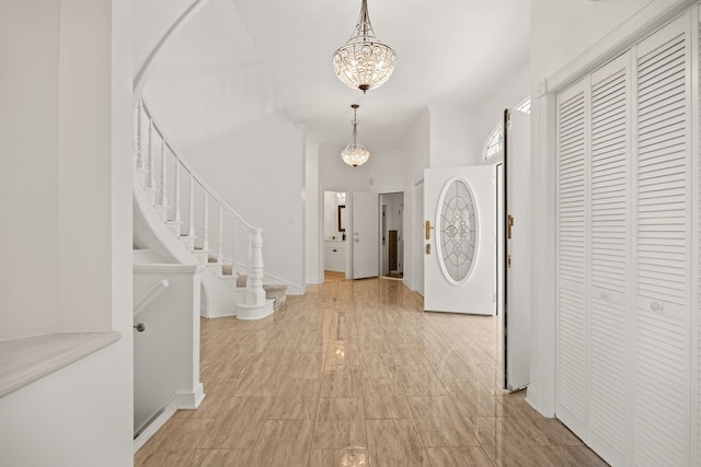 W3318 Lake Forest Ln, Lake Geneva, WI 53147 - foyer entrance featuring a chandelier and stairs