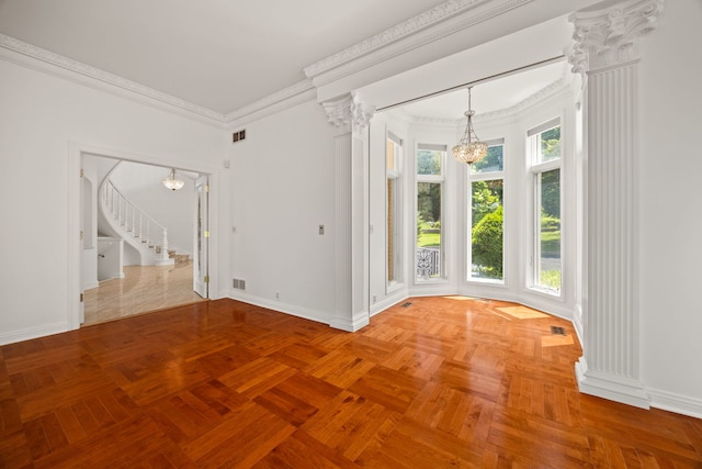 W3318 Lake Forest Ln, Lake Geneva, WI 53147 - empty room featuring a chandelier, crown molding, stairs, and ornate columns