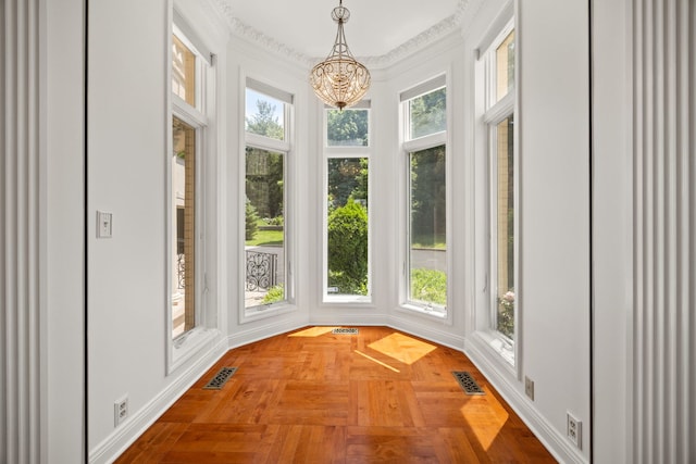 W3318 Lake Forest Ln, Lake Geneva, WI 53147 - unfurnished sunroom with a chandelier and ornamental molding
