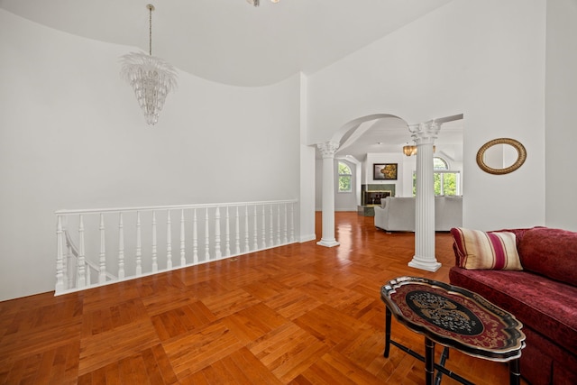 W3318 Lake Forest Ln, Lake Geneva, WI 53147 - living area with decorative columns, arched walkways, and a high ceiling