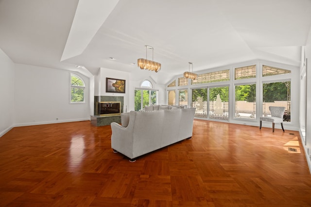 W3318 Lake Forest Ln, Lake Geneva, WI 53147 - unfurnished living room with a high end fireplace and vaulted ceiling