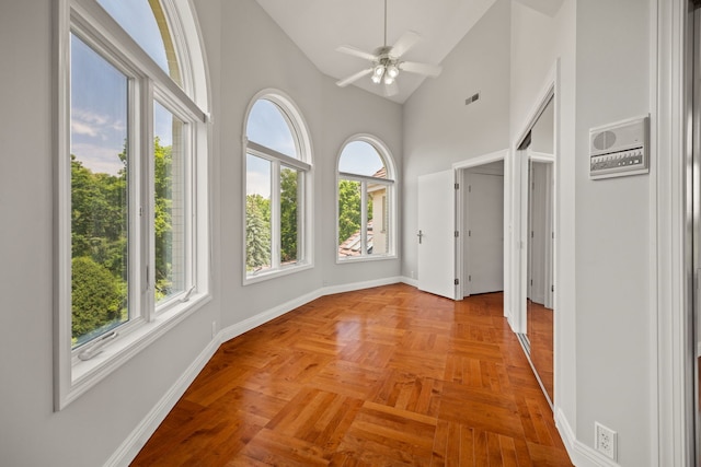 W3318 Lake Forest Ln, Lake Geneva, WI 53147 - unfurnished sunroom featuring baseboards and high vaulted ceiling