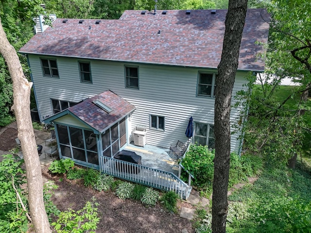462 Kelly Ln, Crystal Lake, IL 60012 - rear view of house with a sunroom, a wooden deck, a chimney, and roof with shingles