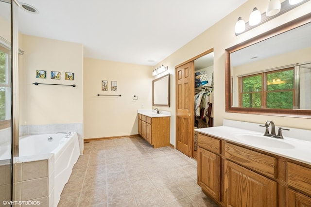 462 Kelly Ln, Crystal Lake, IL 60012 - full bathroom featuring two vanities, a bath, tile patterned flooring, and a shower with shower door