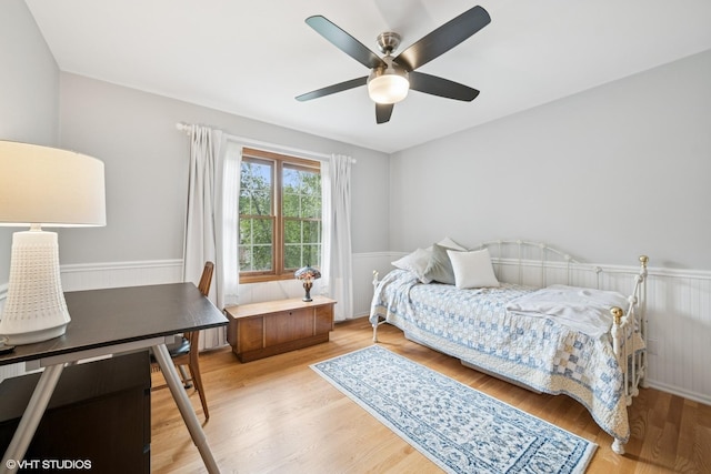 462 Kelly Ln, Crystal Lake, IL 60012 - bedroom with a wainscoted wall, light wood finished floors, and a ceiling fan