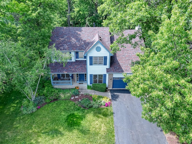 462 Kelly Ln, Crystal Lake, IL 60012 - traditional-style house with a porch, a front yard, a garage, and asphalt driveway
