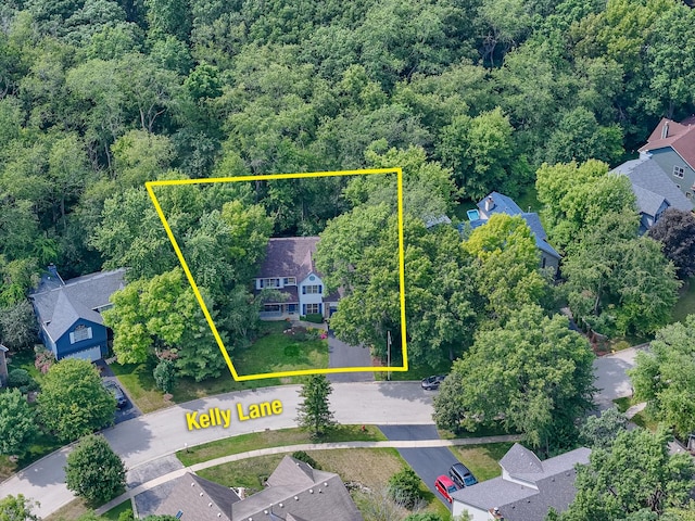 462 Kelly Ln, Crystal Lake, IL 60012 - aerial view of residential area with property boundaries highlighted and a heavily wooded area